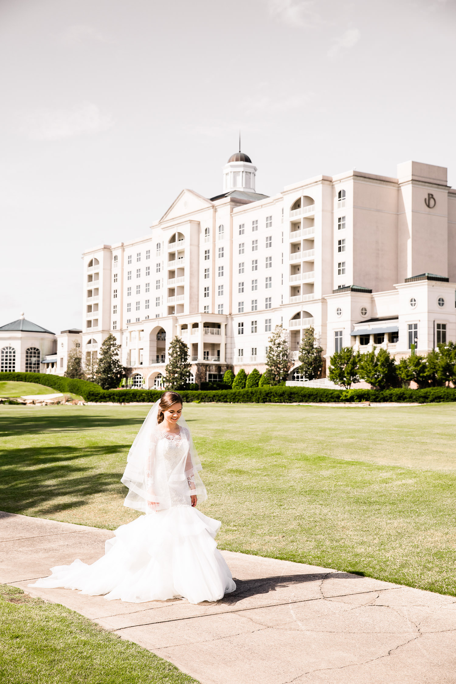 Bride in front of Ballantyne Hotel for wedding in Charlotte