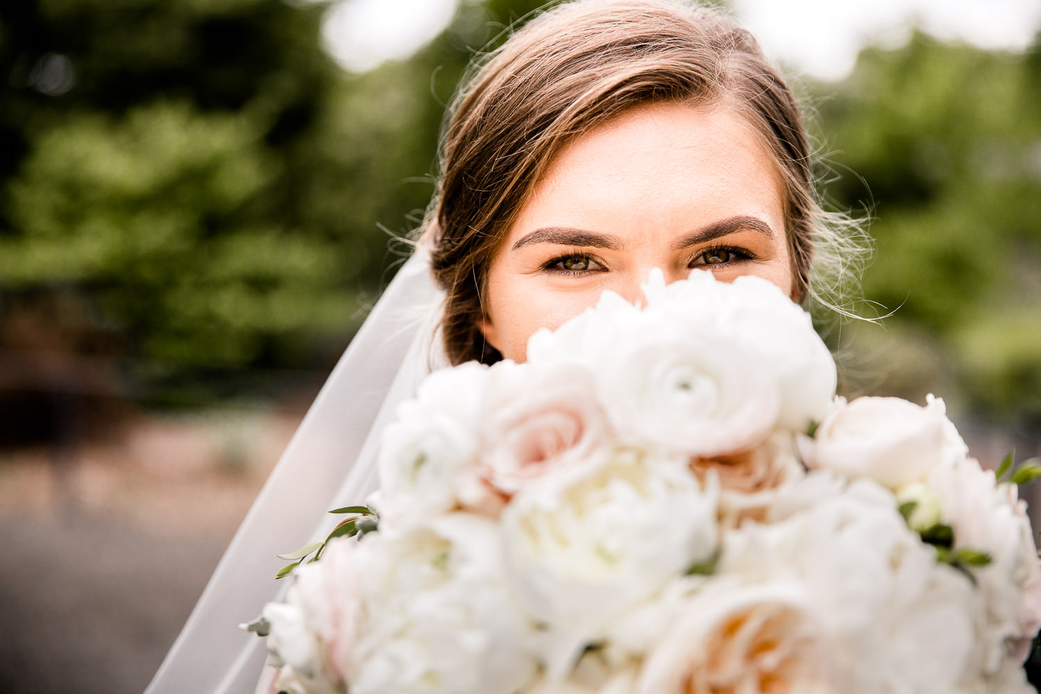 Bride with bouquet at Daniel Stowe Botanical Garden