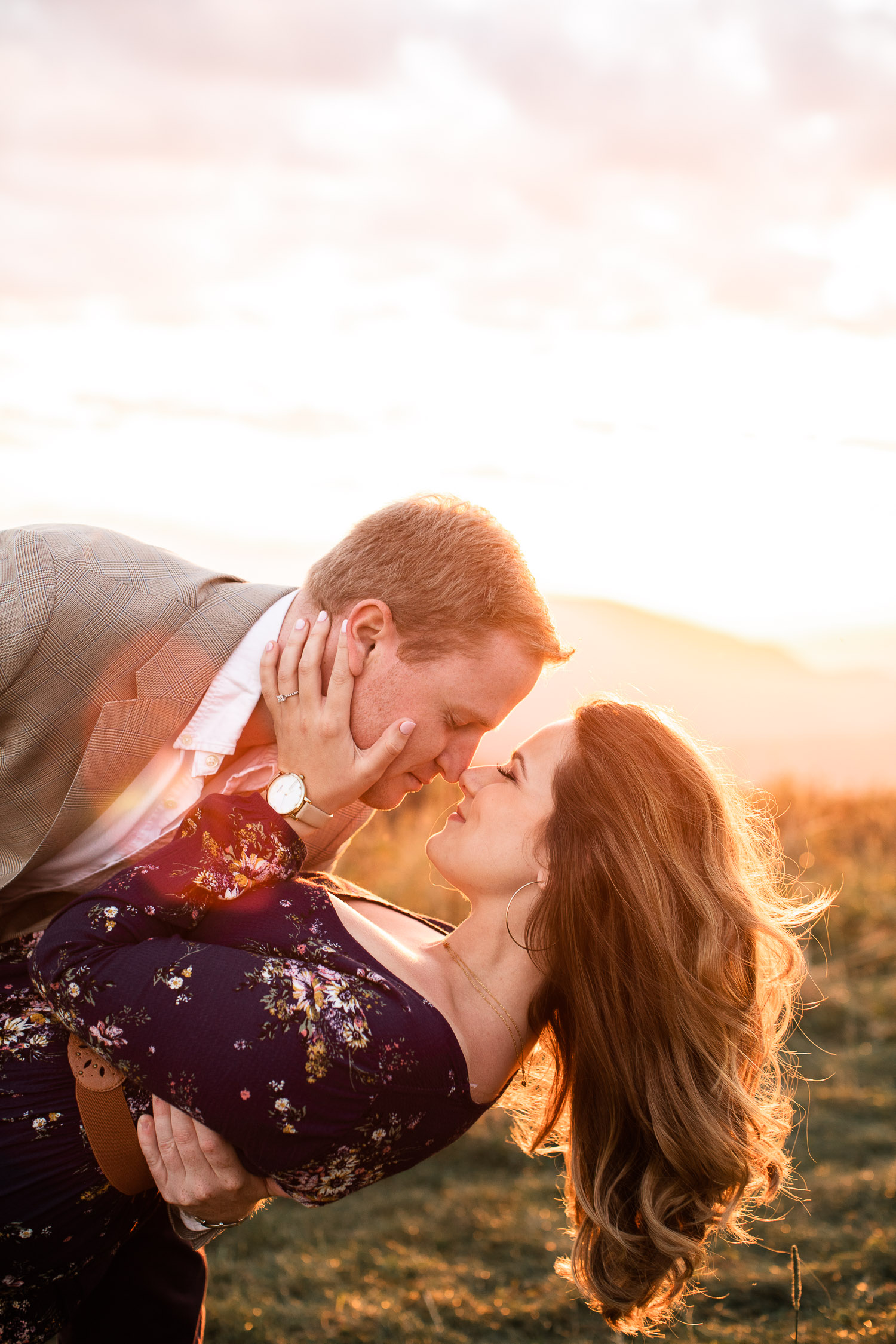 Max Patch Engagement session, Man dipping woman for a kiss during sunset