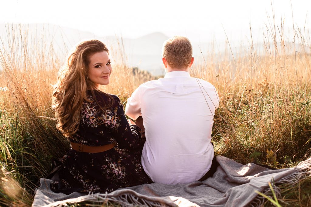 Max Patch Engagement session, couple sitting on picnic blanket