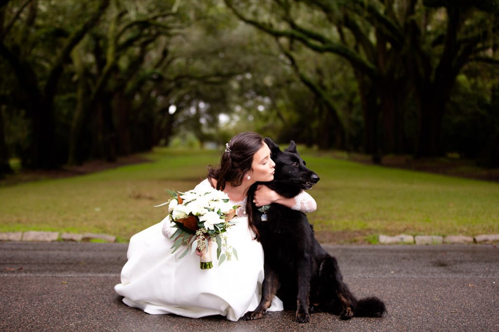 Bride poses with her puppy 