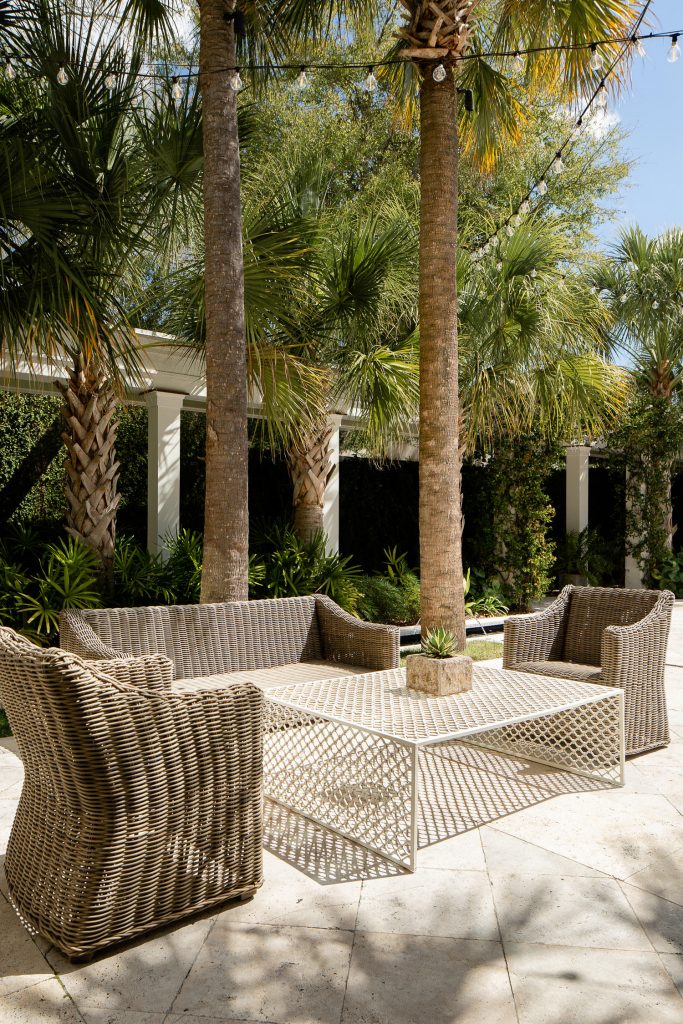 Cannon Green courtyard, lounge seating surrounded by palmettos
