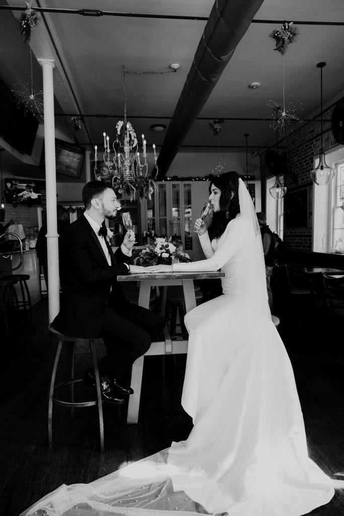 Couple enjoying the cake after their Charleston elopment