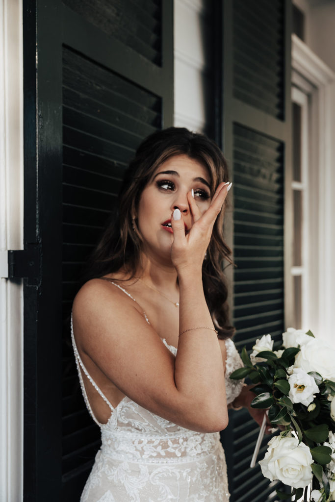 Bride is in tears at her first touch with groom