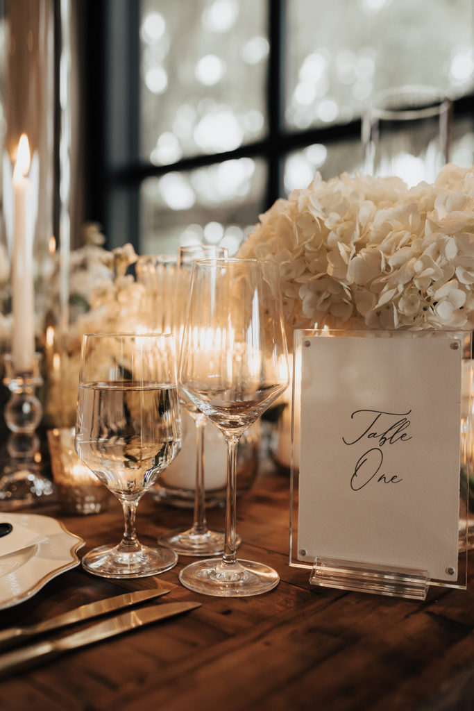 Elegant Table sign and glasses for wedding at middleton place