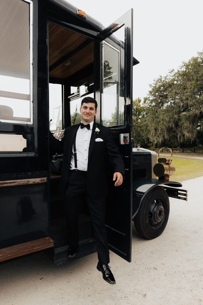 Groom arriving with trolly for wedding at middleton place