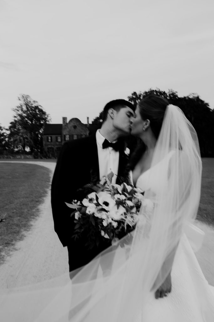 Bride and groom kissing at Middleton Place fall wedding