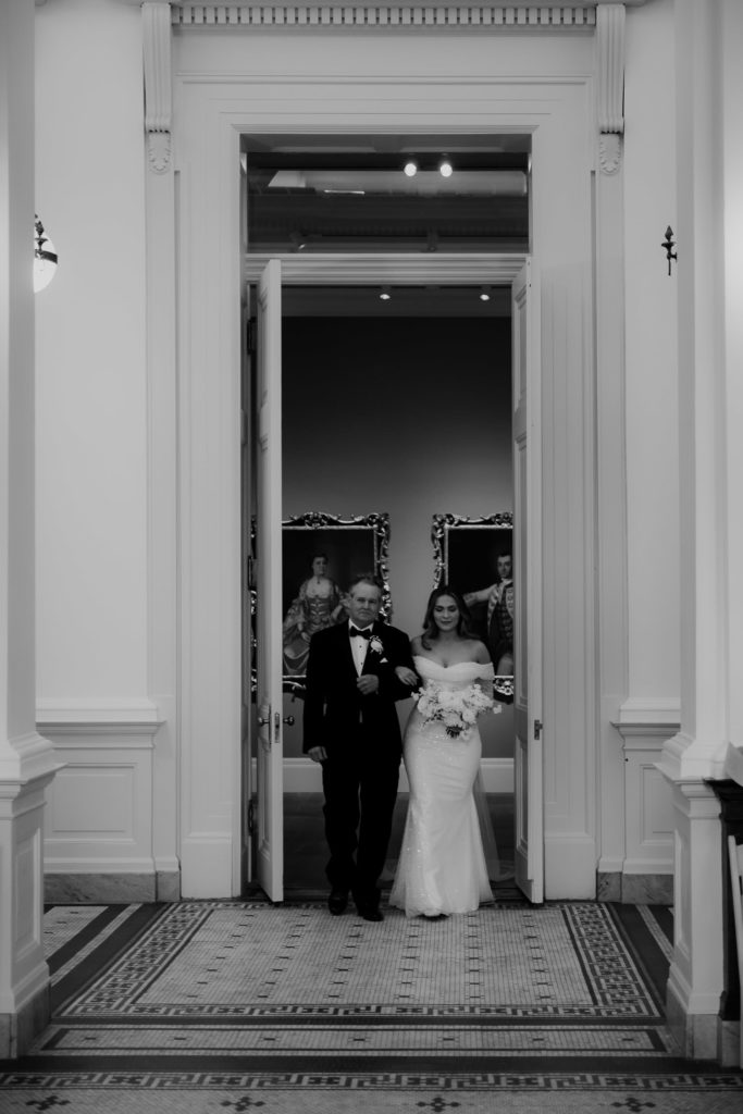 Bride entering the ceremony with father at Gibbes Museum