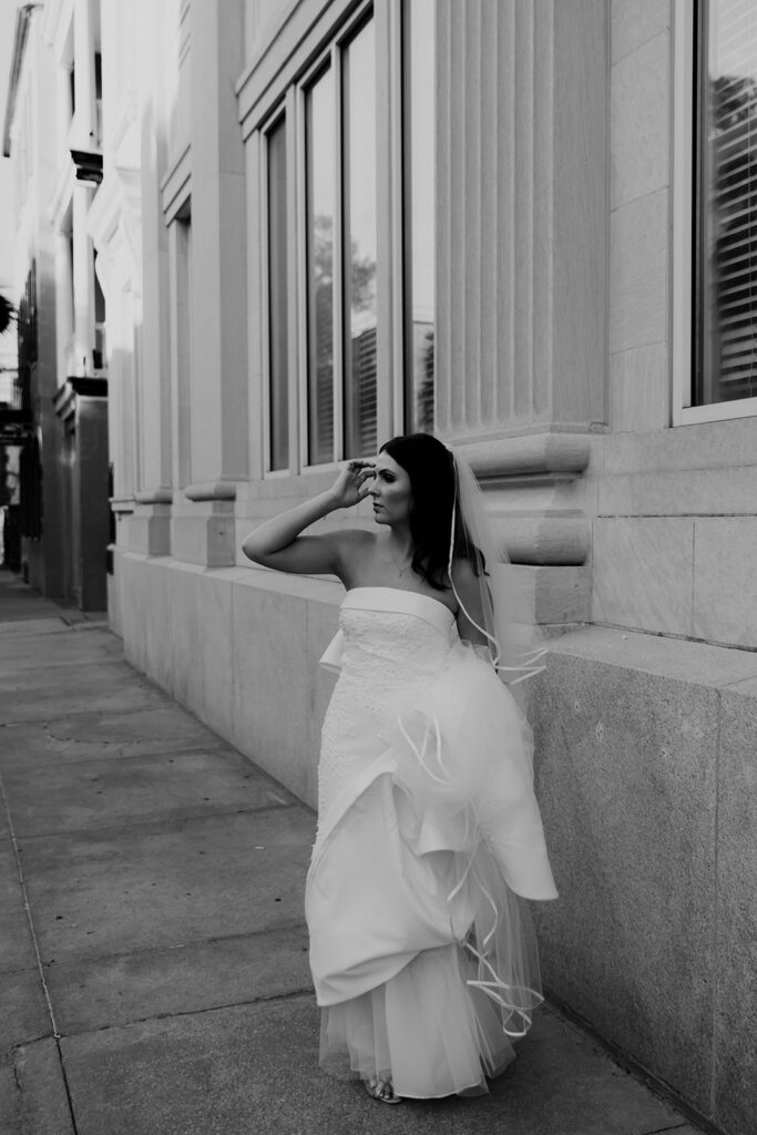 Urban style bridal photo with windoes in background