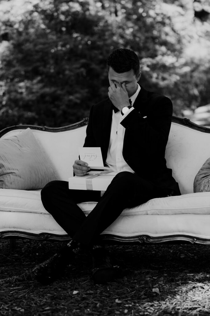 Groom opens gift and reads letter from bride