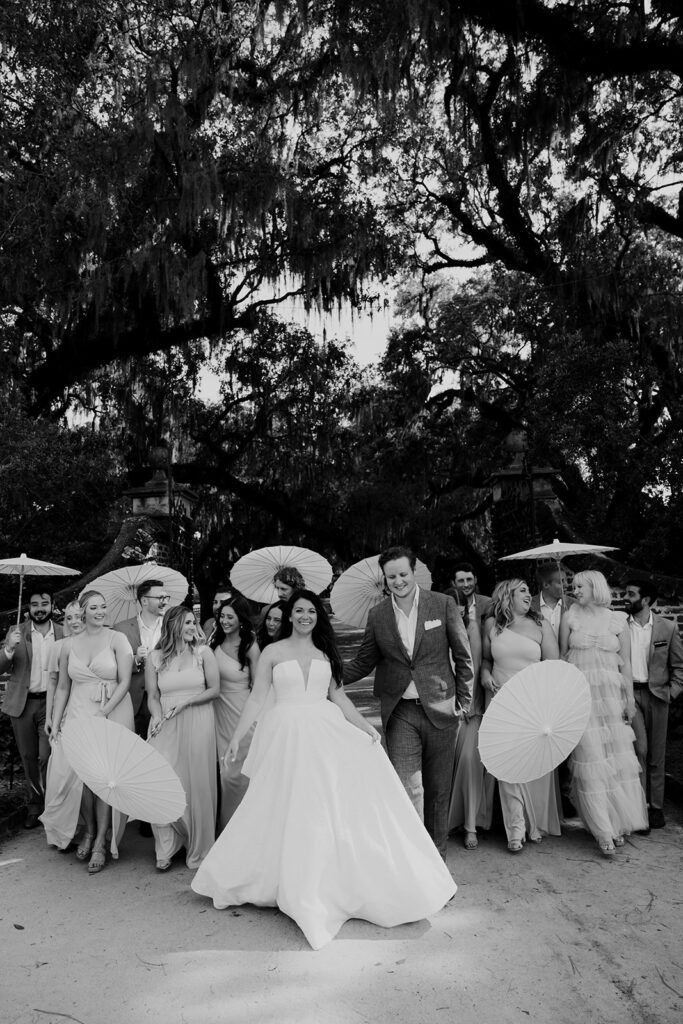 Bridal party taking photos at Boone Hall plantation wedding