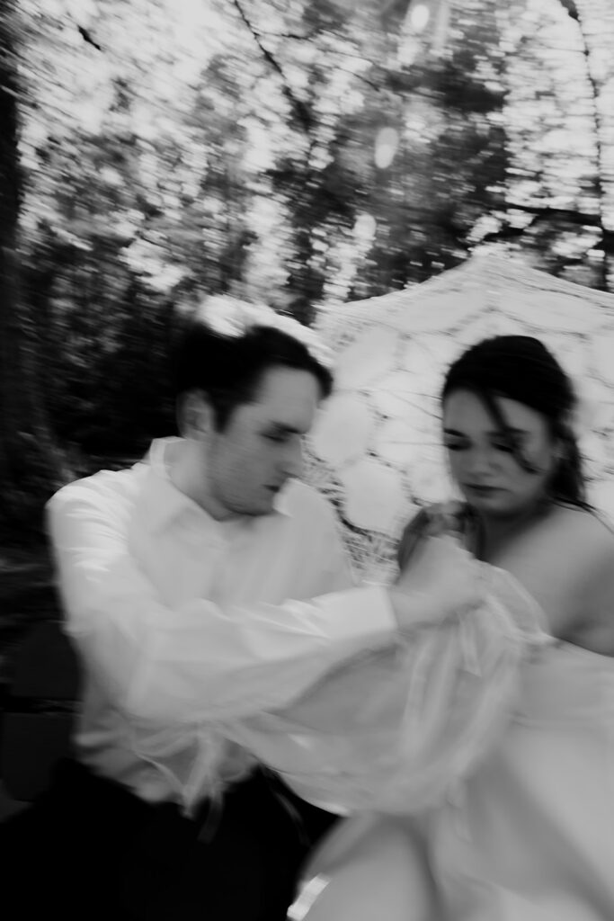 Artsy Cypress garden engagement photo of couple in black & white