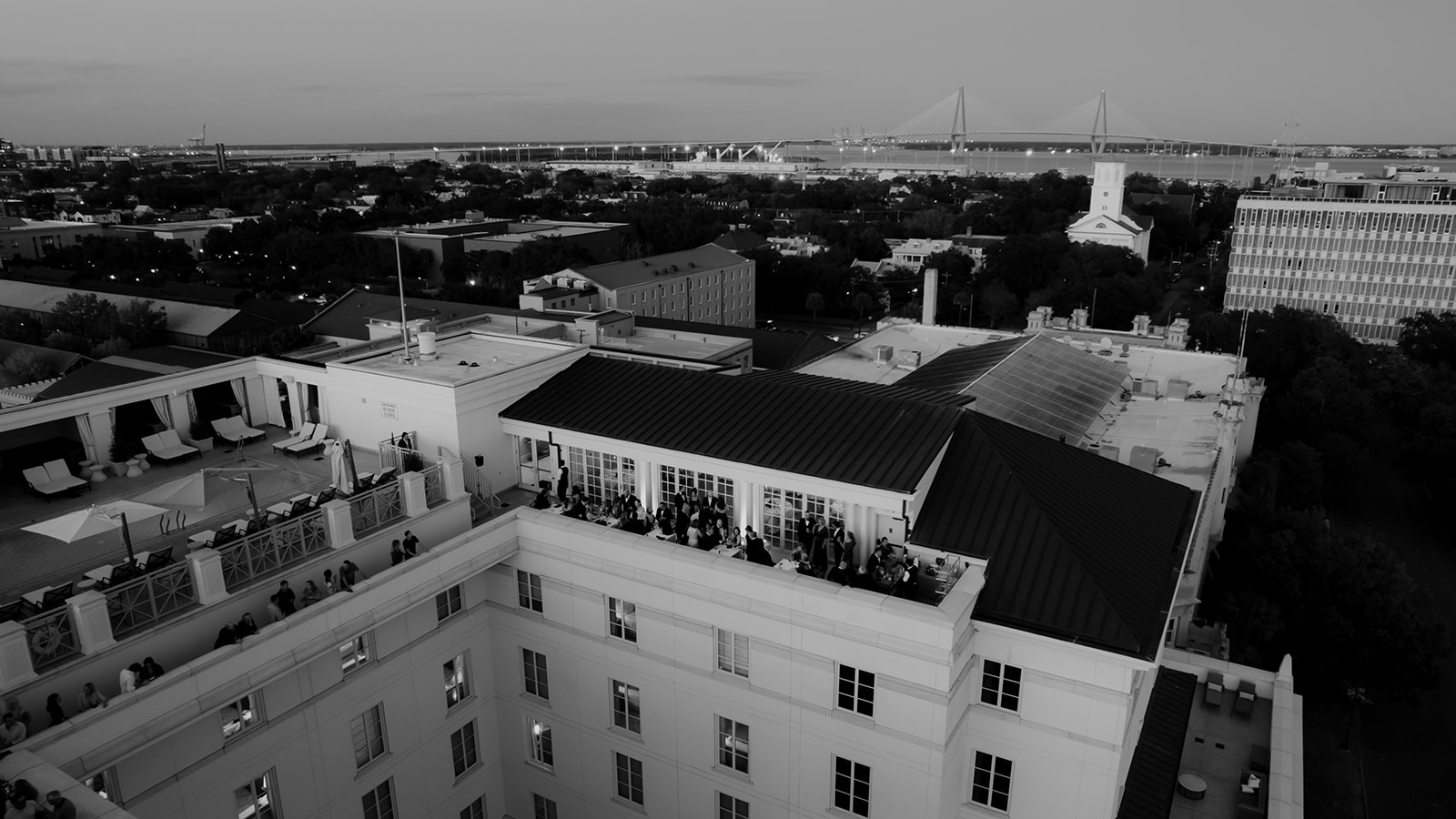 Aerial photo of cocktail hour on rooftop at Hotel Bennett Wedding