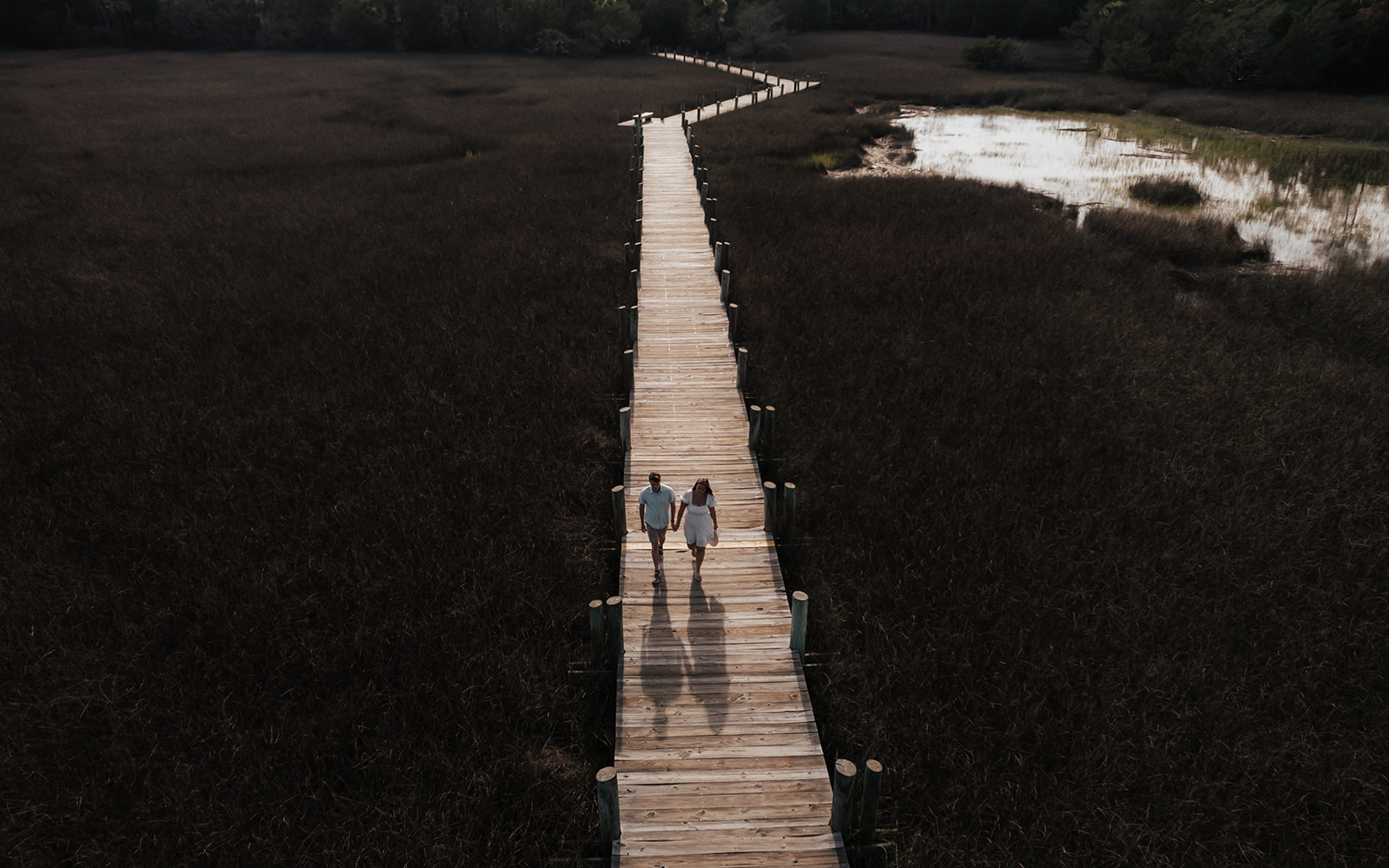 Arial photo of couple walking on boardwalk at Palmetto Islands County Park