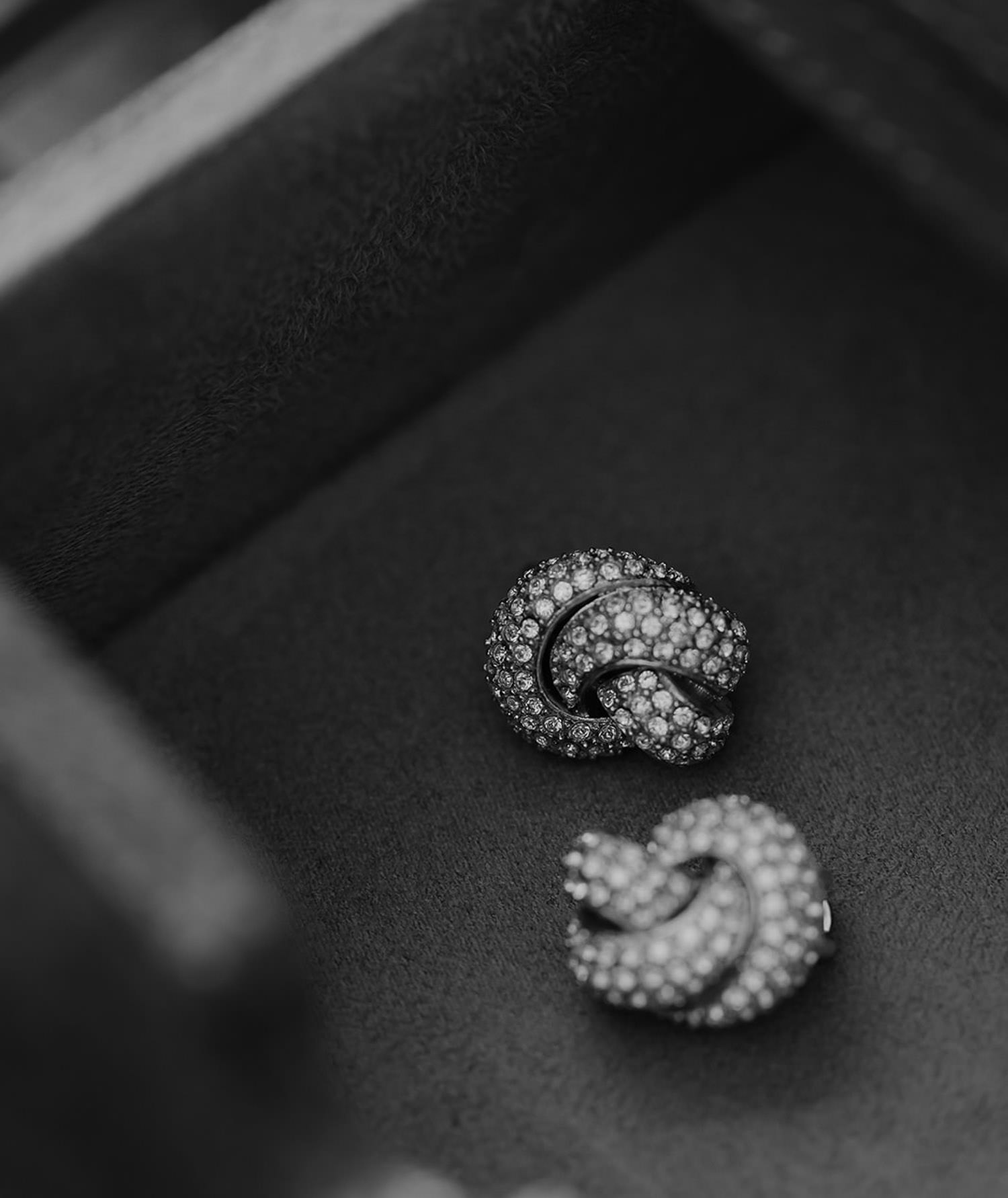 Black and white photo of earings