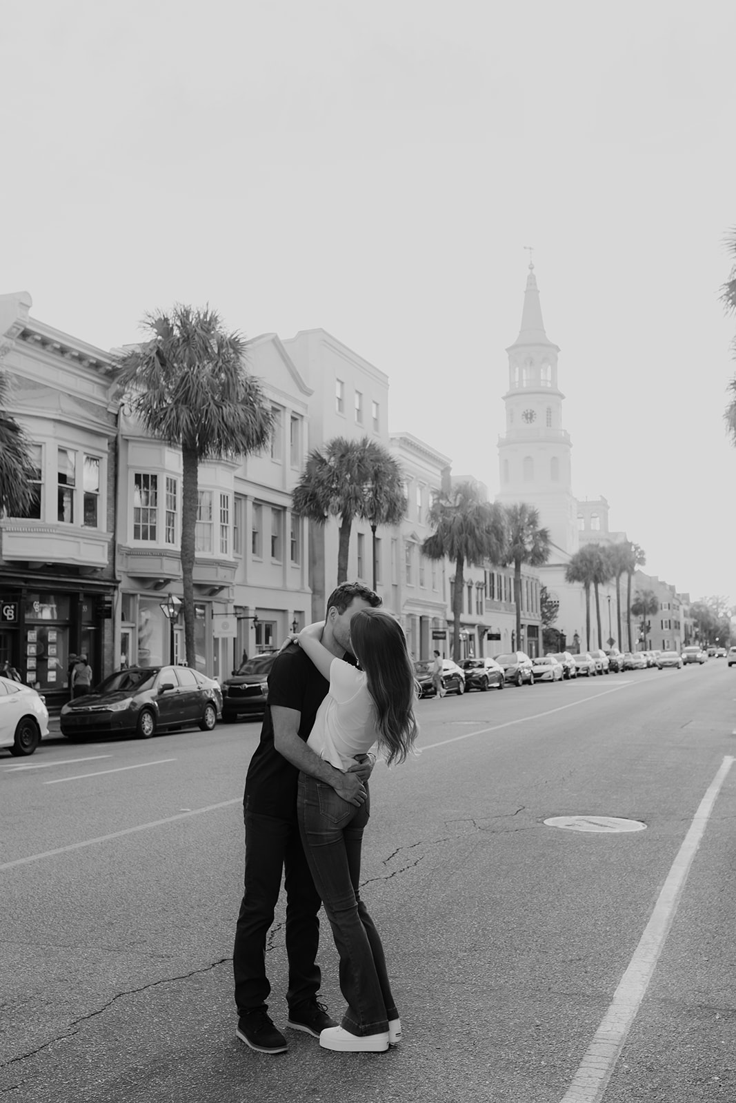 Couple kissing on Charleston street during Charleston Engagement photo Session