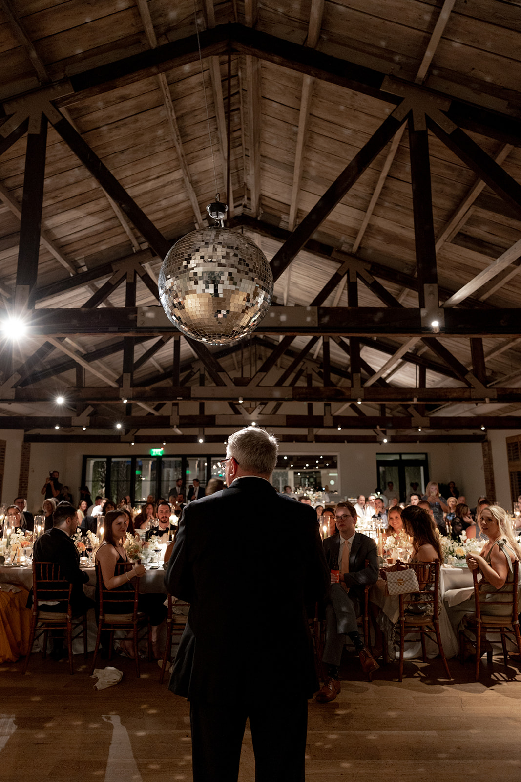 Father of bride holding speech under disco ball at Cannon Green wedding