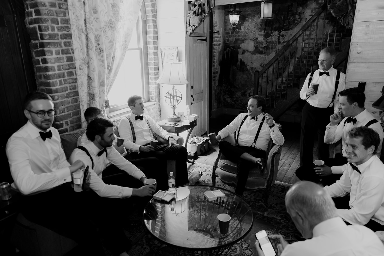 Groomsmen sitting together in William Aiken House carriage suite