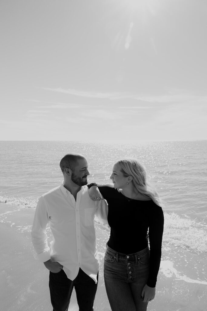 Woman leaning on shoulder while both standing next to each other posing for Seabrook Island Beach Engagement photo session