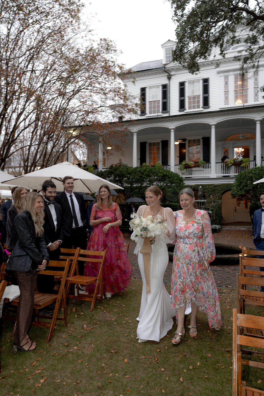 Bride is walking down the aisle at Wedding. Gov. Thomas Bennett House in the background