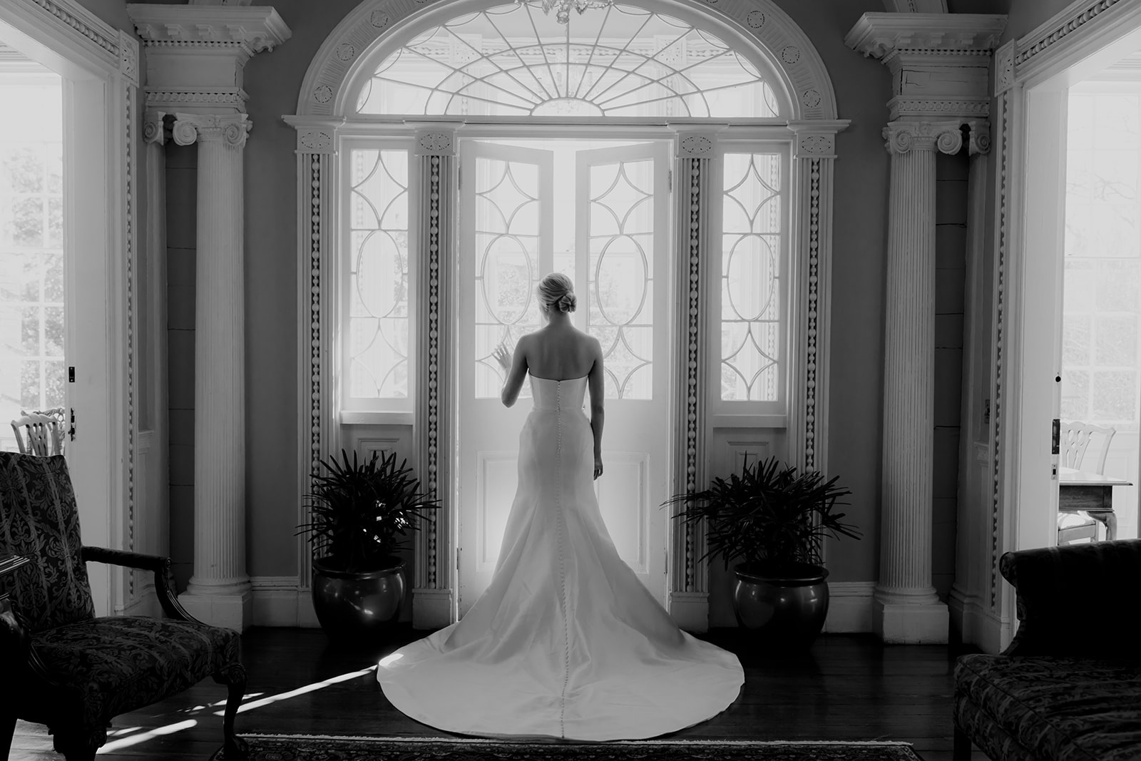 Black and white photo to highlight wedding dress and bride