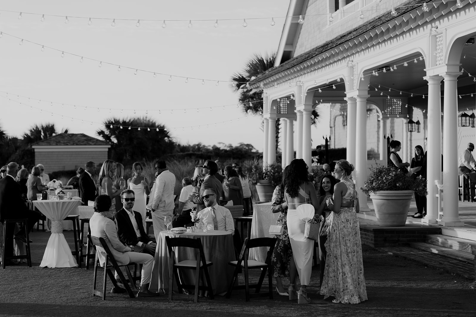 Cocktail hour at Kiawah Ocean Course wedding. Guest enjoying summer night.