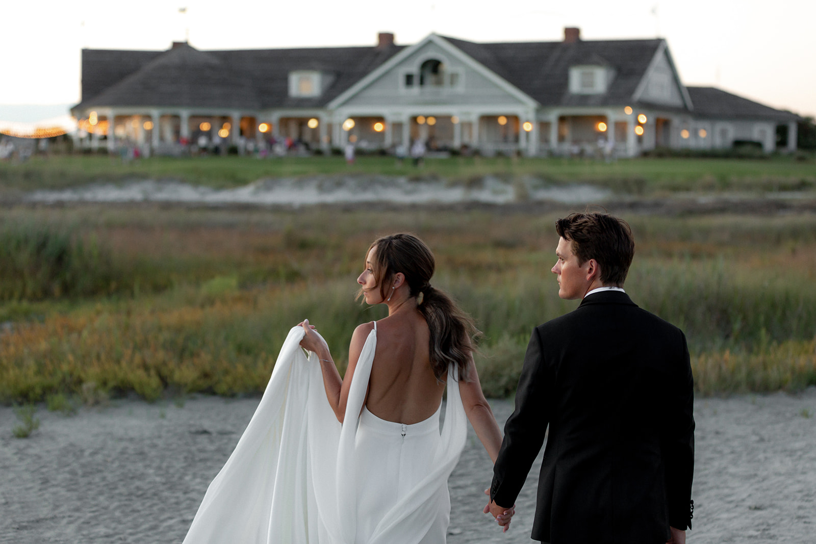 Bride and groom on their way to the Kiawah Ocean Course club house