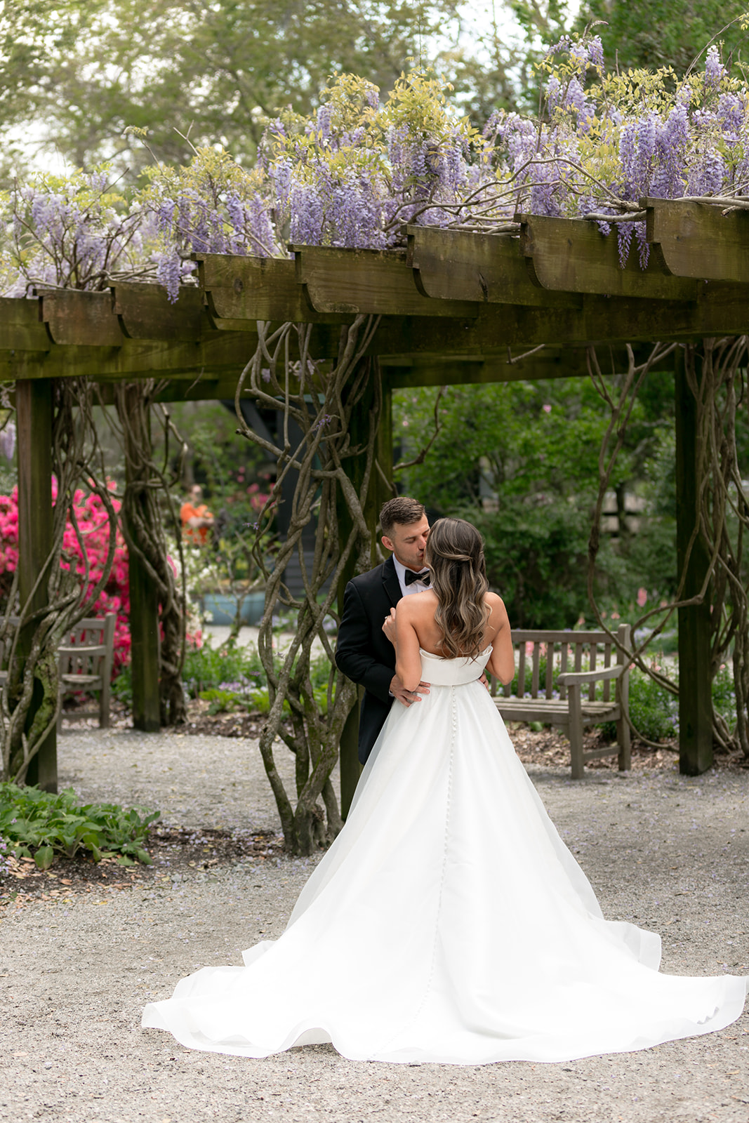 Couple portraits taken at Magnolia Plantation Wedding surrounded by colorful flowers.