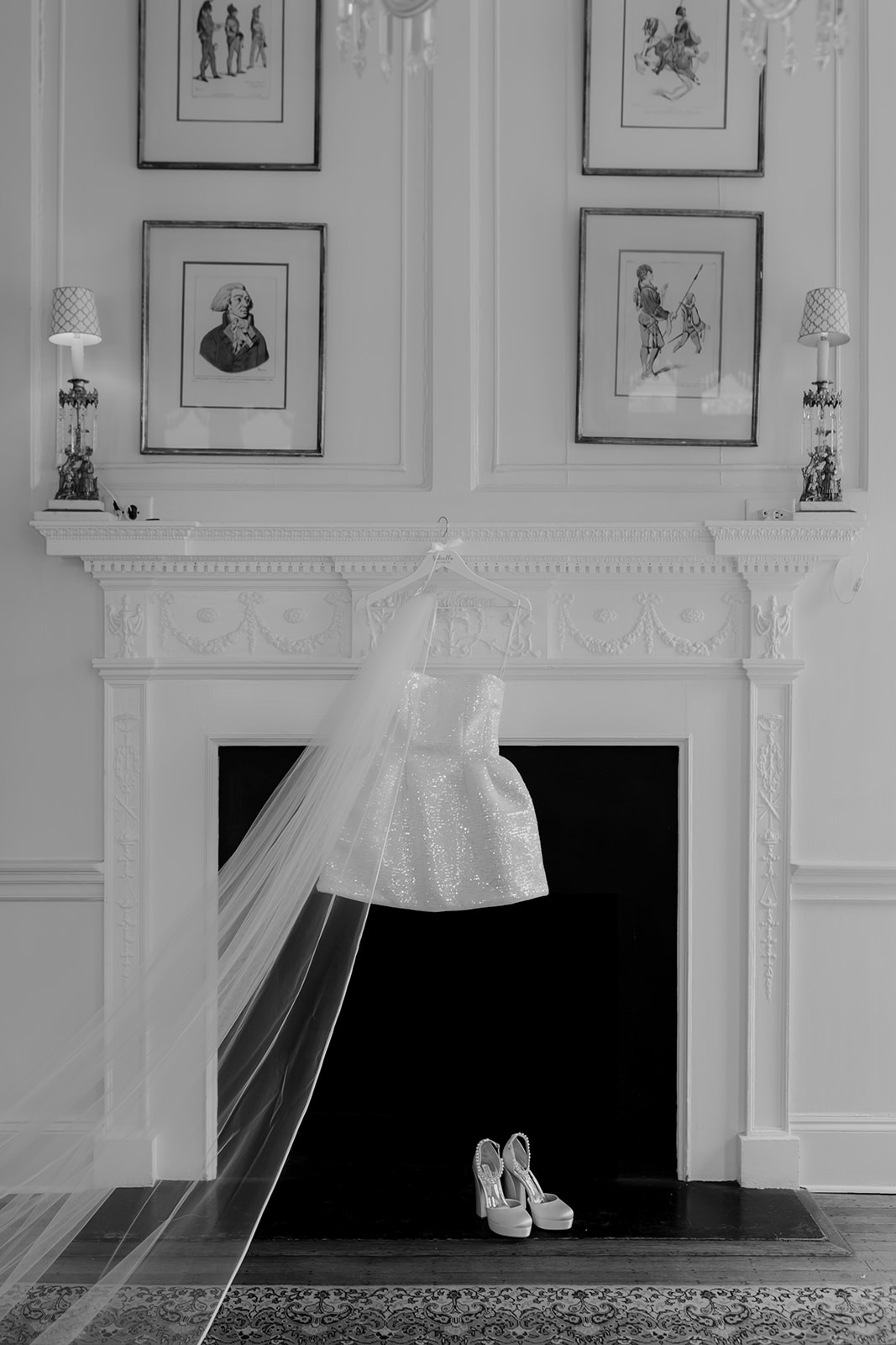 Cocktail dress for Lowndes Grove wedding hanging at decorative fireplace