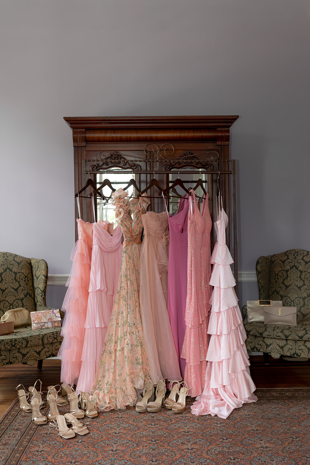 Pink Bridesmaids dresses hangig decoratively before Lowndes Grove wedding