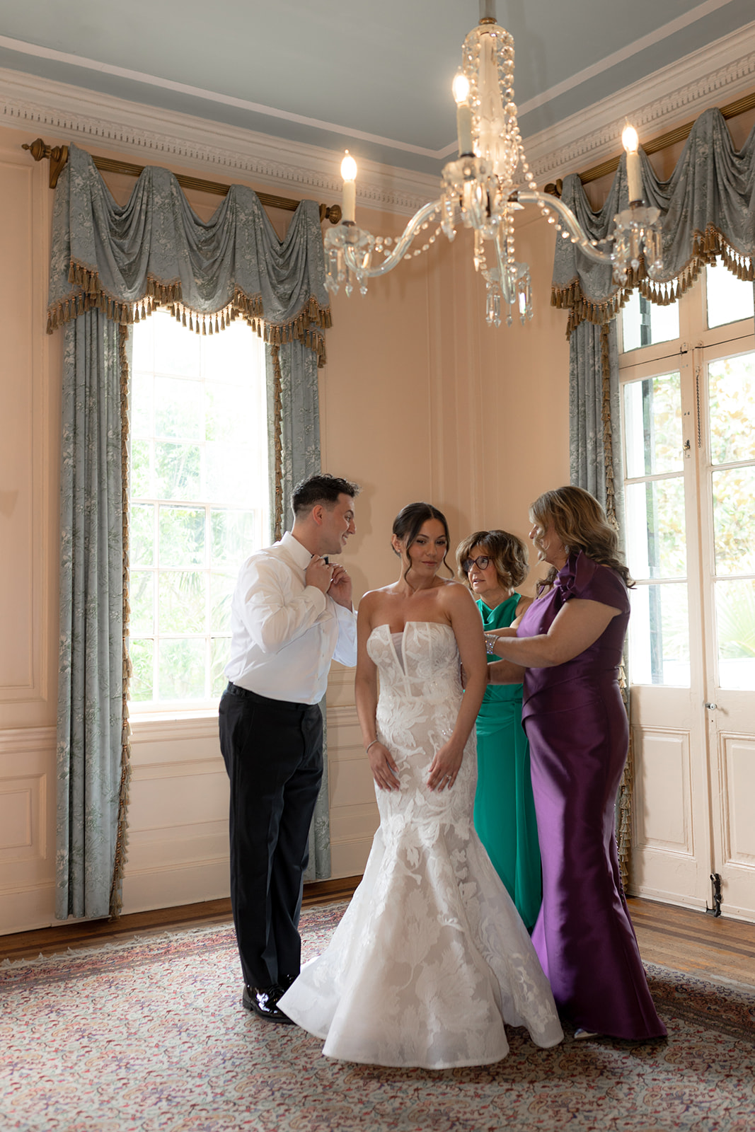 Bride getting ready for wedding ceremony with her close family