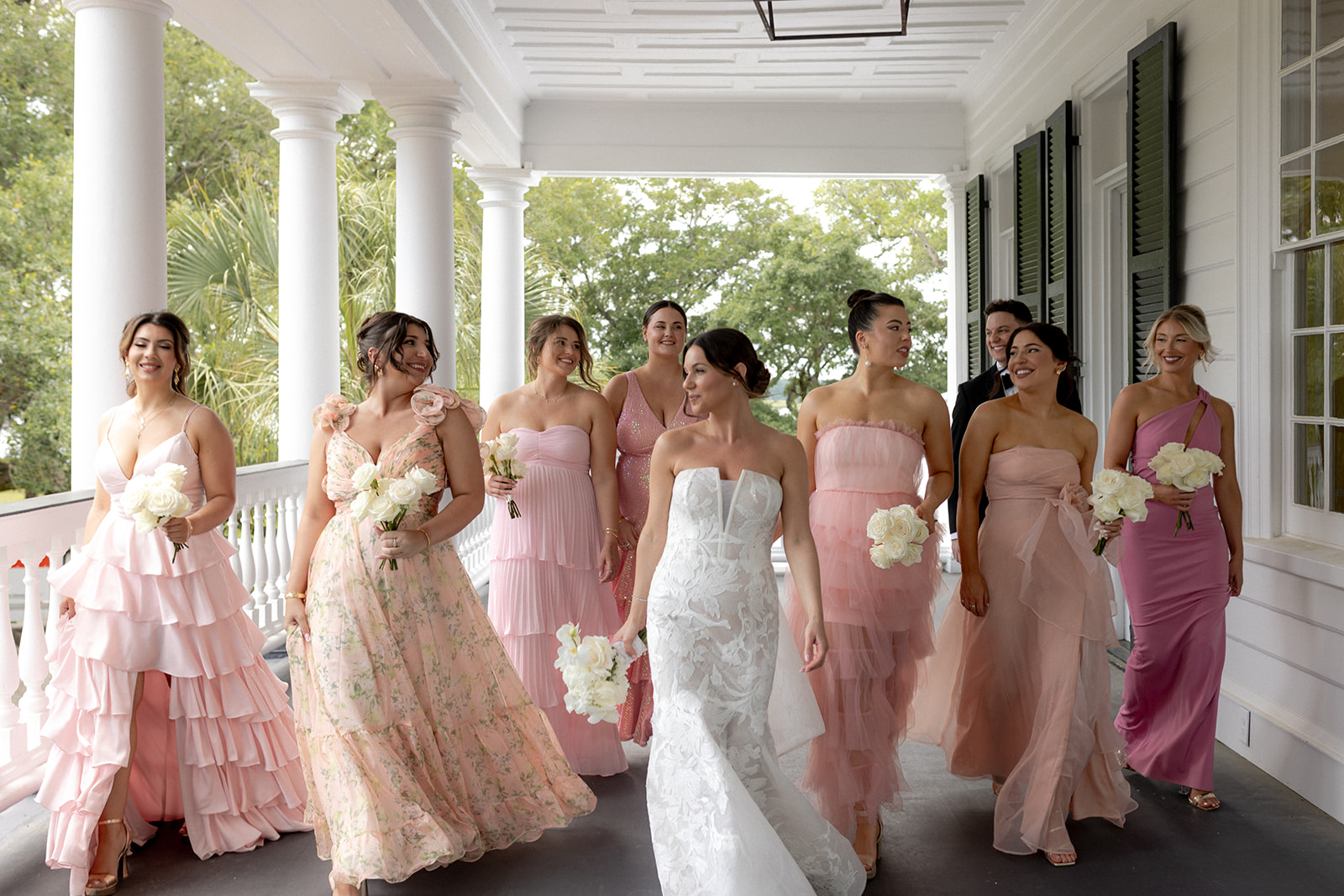 Bride and bridesmaid showing their dresses