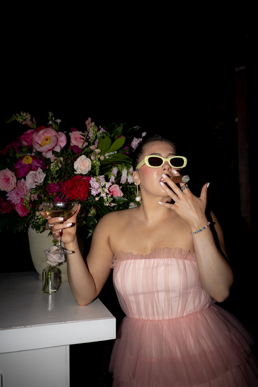 Wedding guest enjoying a cigar and a Martini 