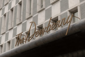 The Dewberry sign with its distinguished window architecture in background