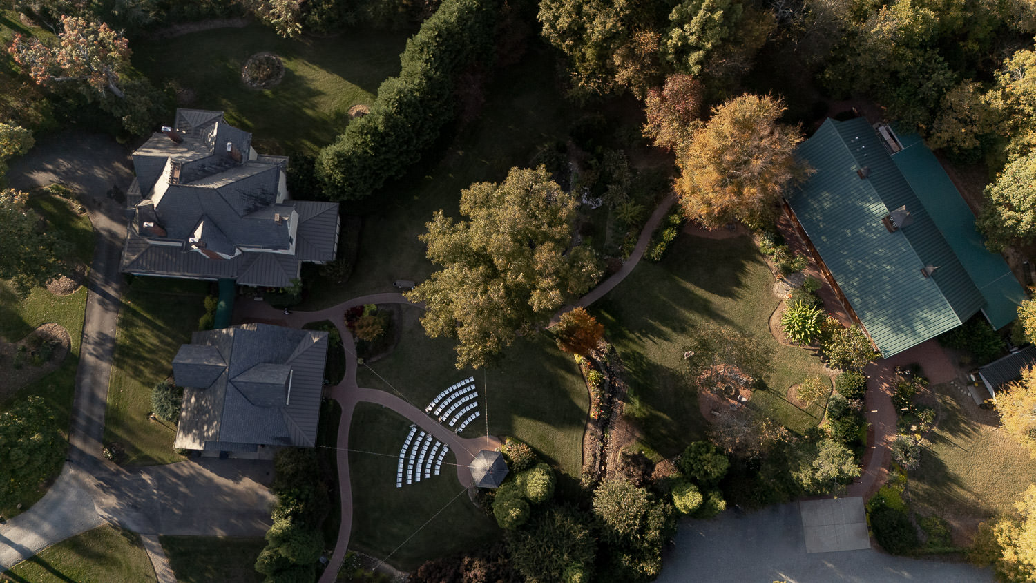 Drone photo of Alexander Homestead wedding venue with ceremony space prepared