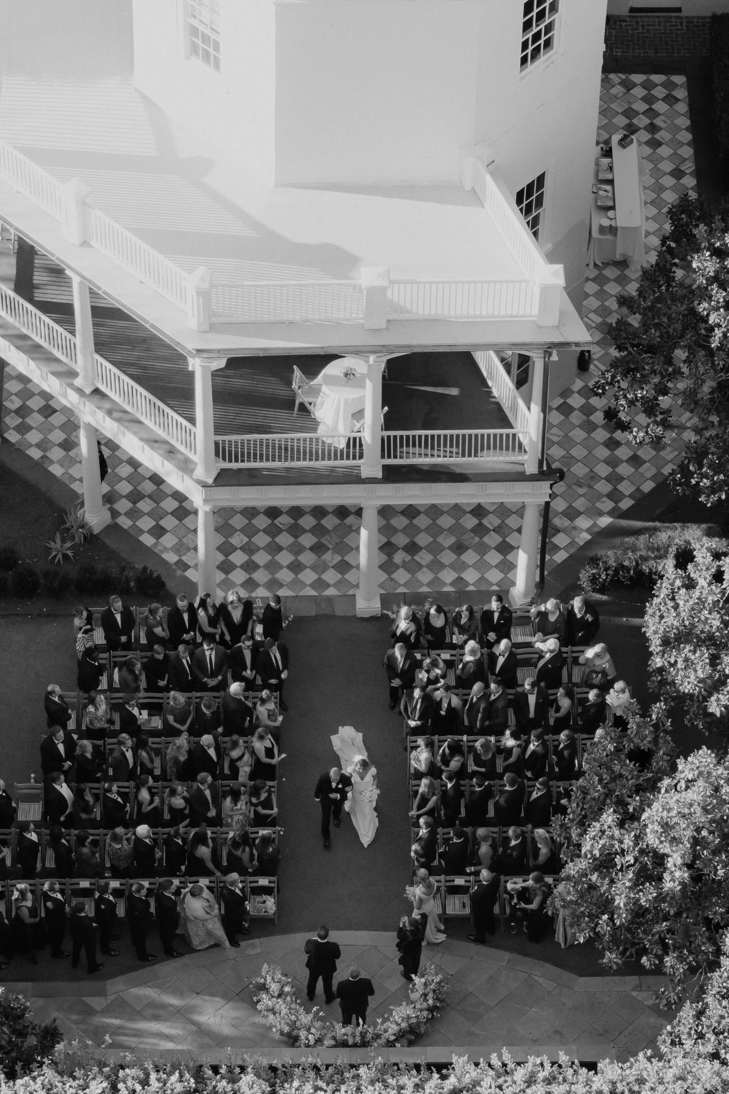 bride walking down the aisle at Charleston wedding captured from above.