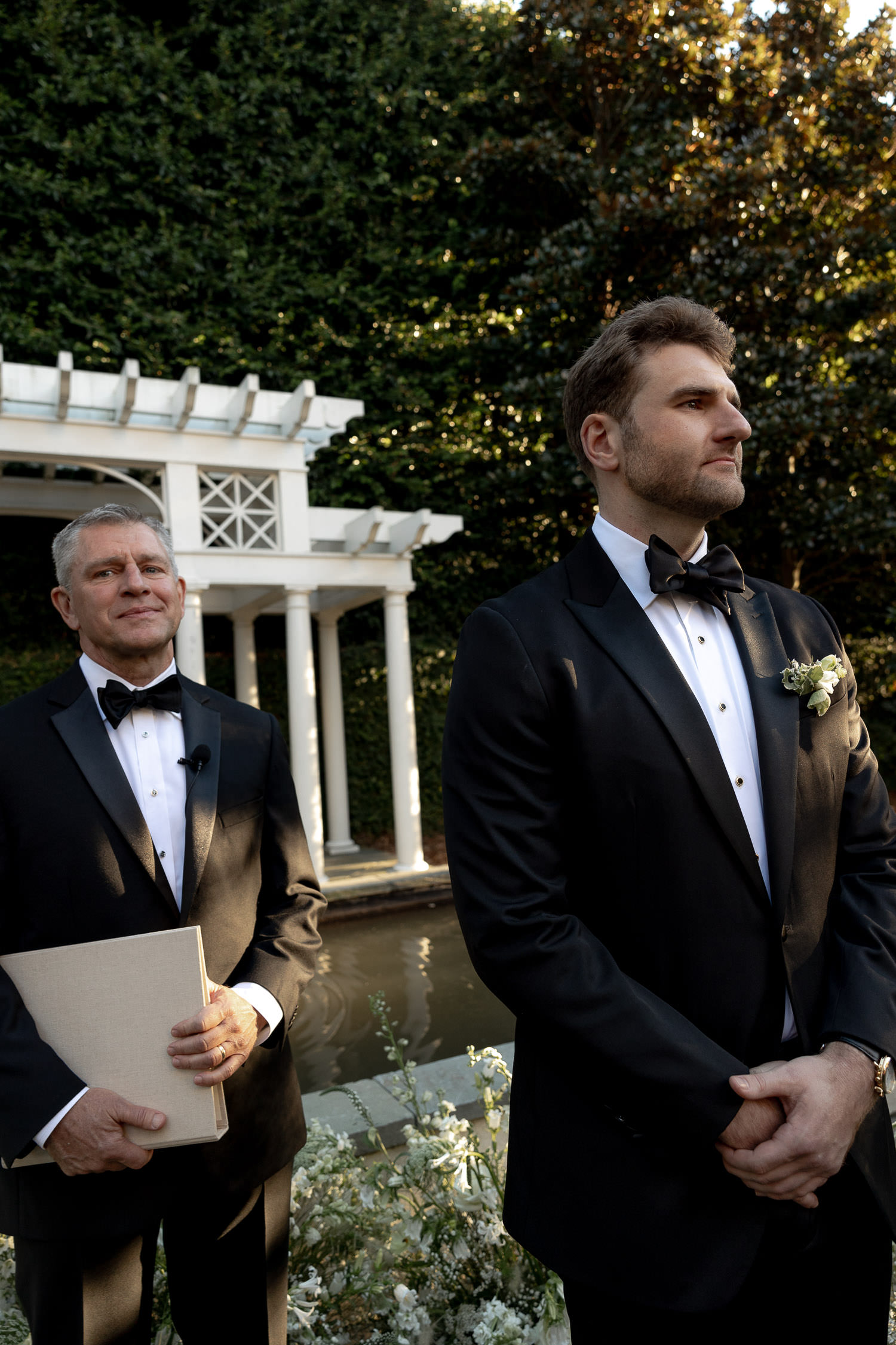 Groom and officiant awaiting the bride walking down the ailse at Charleston wedding