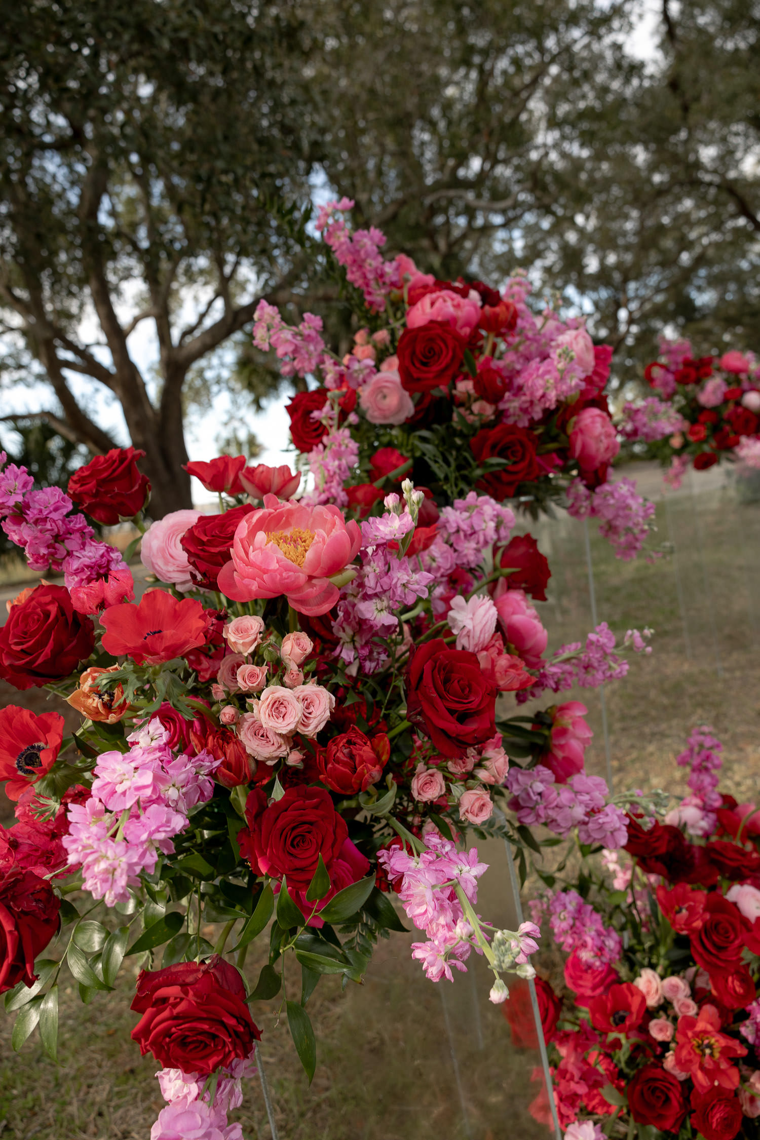 Ceremony flowers at lowndes grove with beautiful Hot pink & Red theme