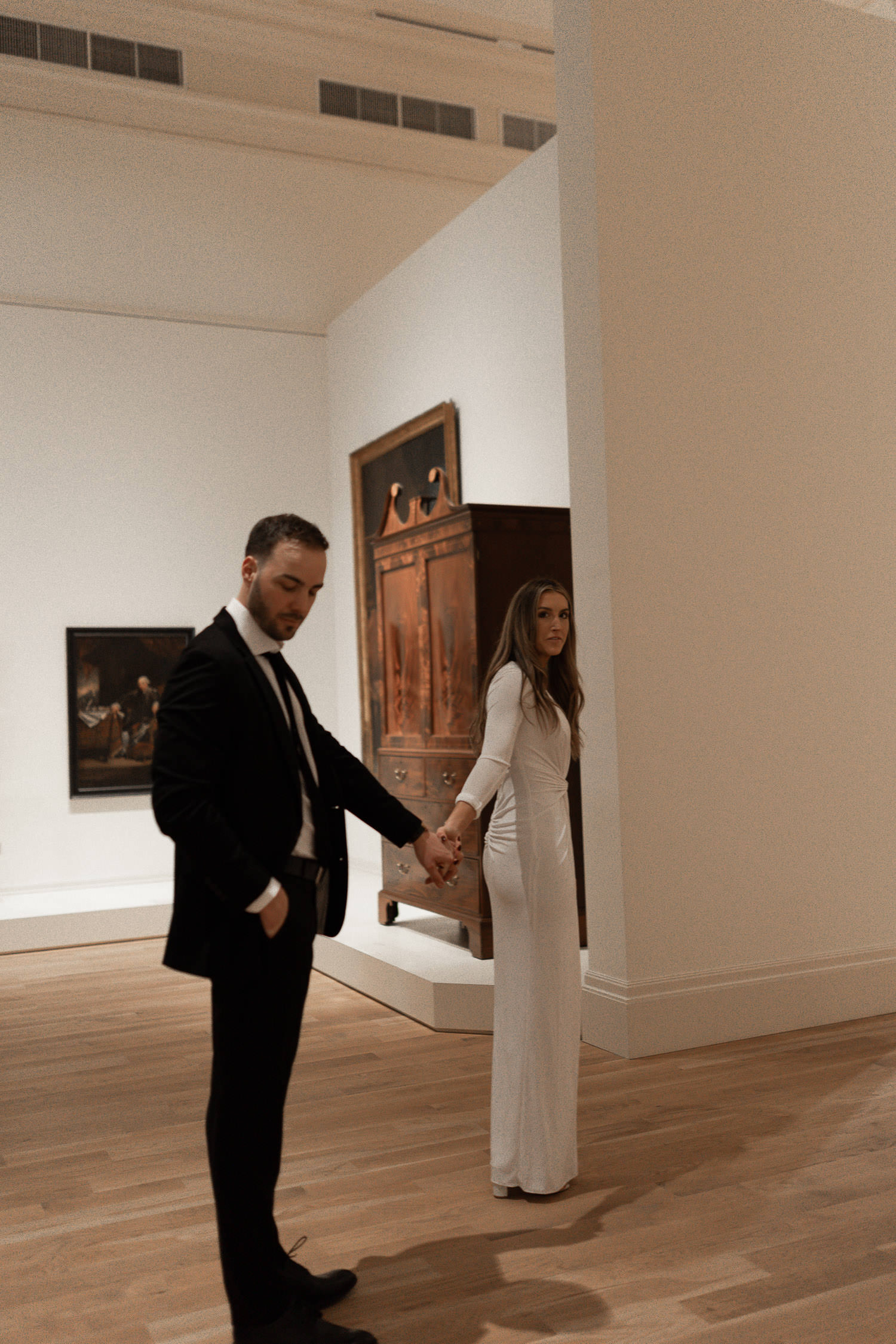 Couple casually exploring during Gibbes Museum Engagement photo session in Charleston