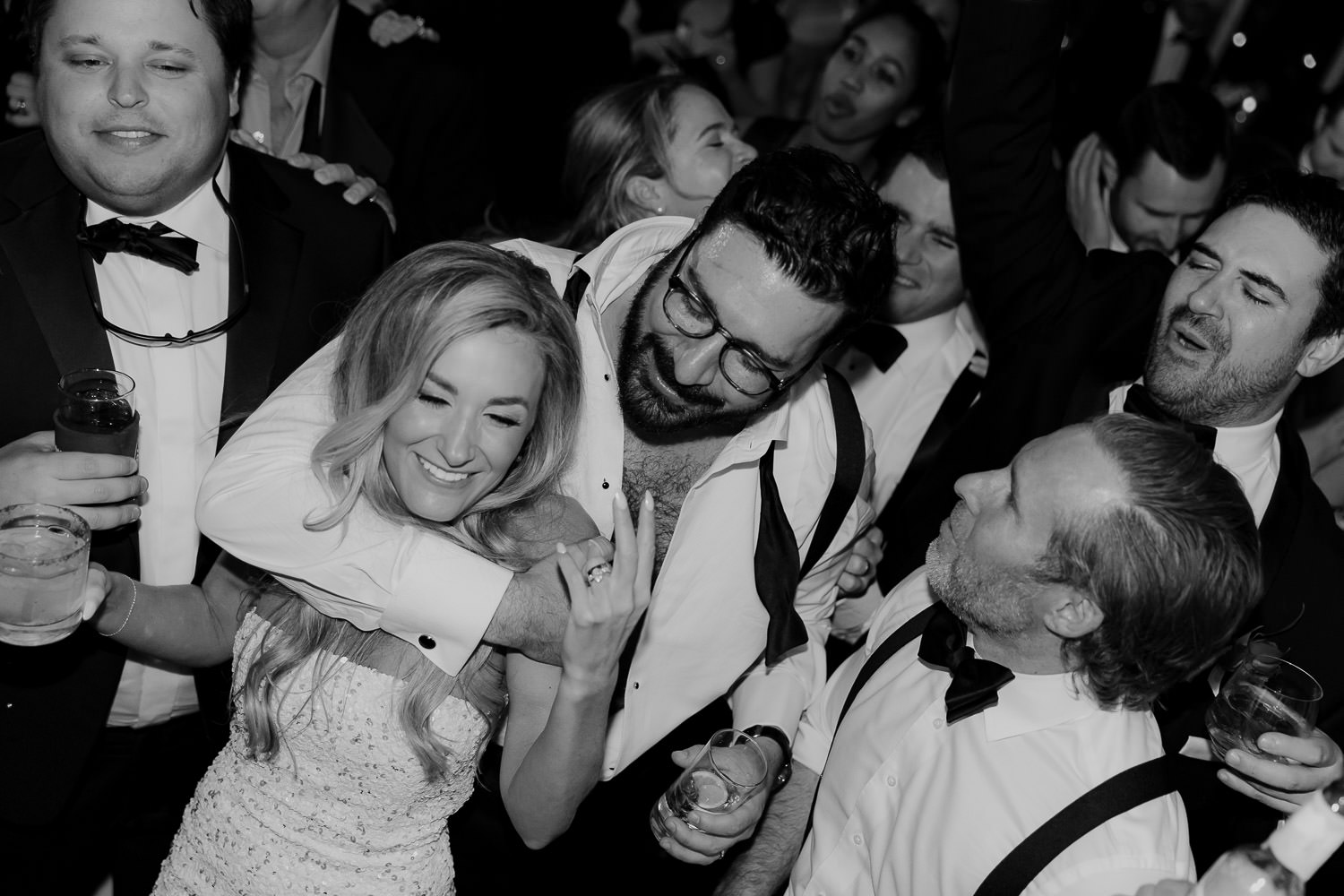 The couple celebrating on the dancefloor captured in black and white