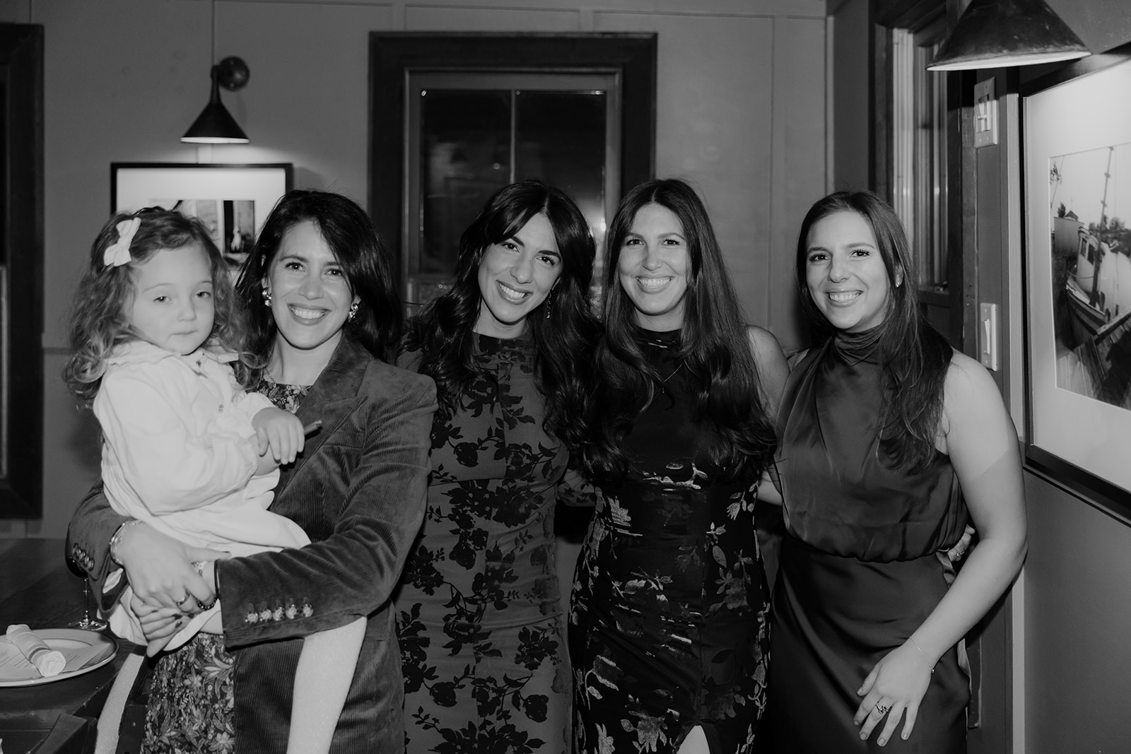 Guests posing for family photo during rehearsal dinner