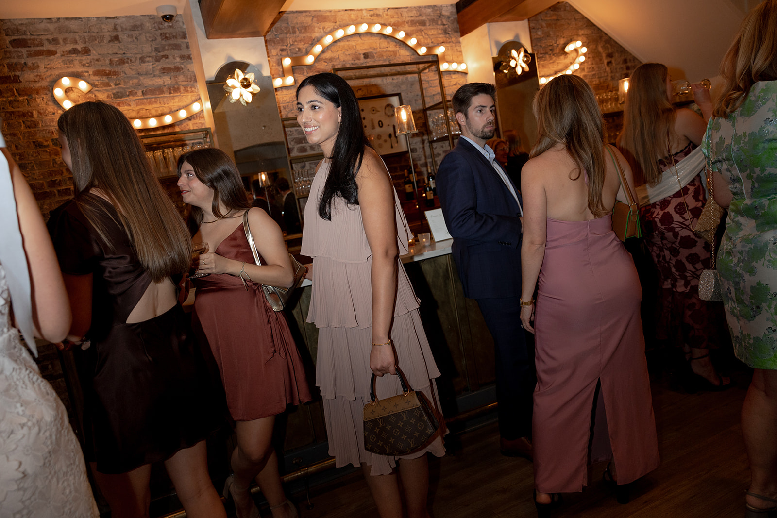 Guests mingle with each other at Rehearsal Dinner at Parcel 32