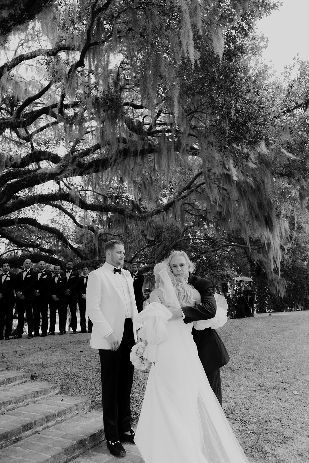 Black and white photo of the father giving away his daughter at Middleton Place Wedding