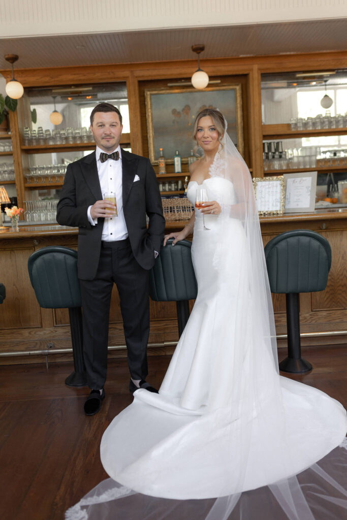 Bride and groom with casual drink at the Post House Inn bar