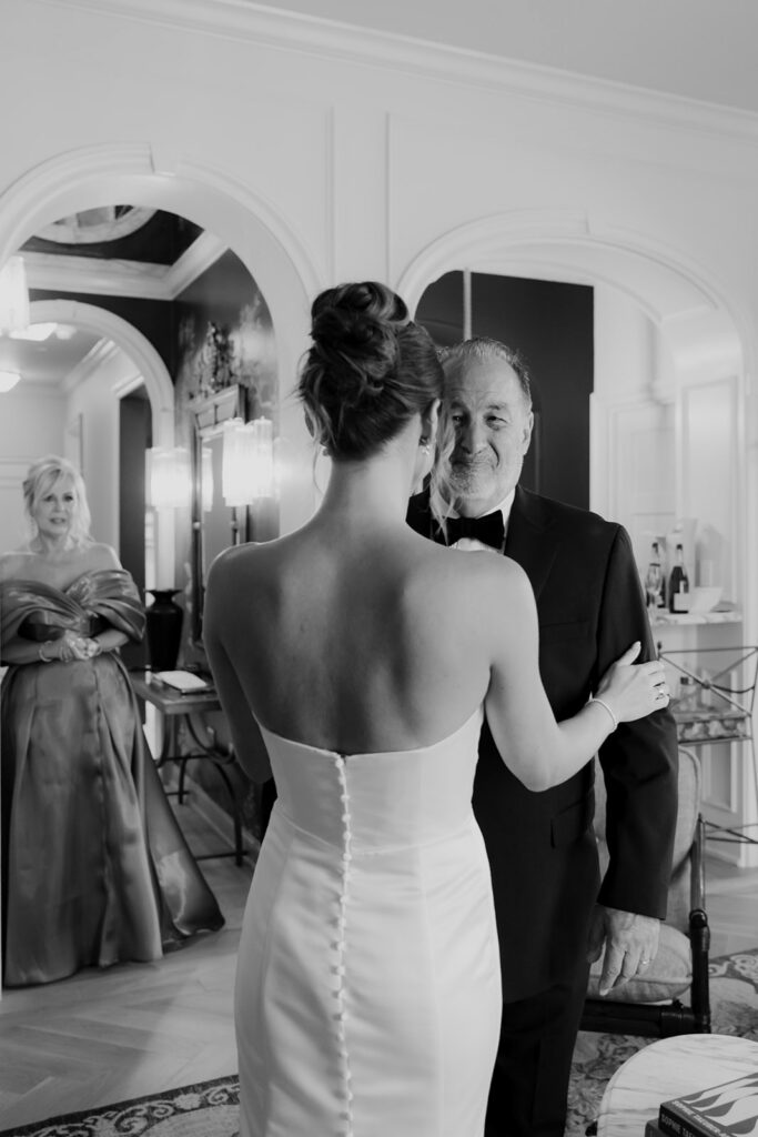 Father of the bride looking at his daughter for the first time when in her dress 